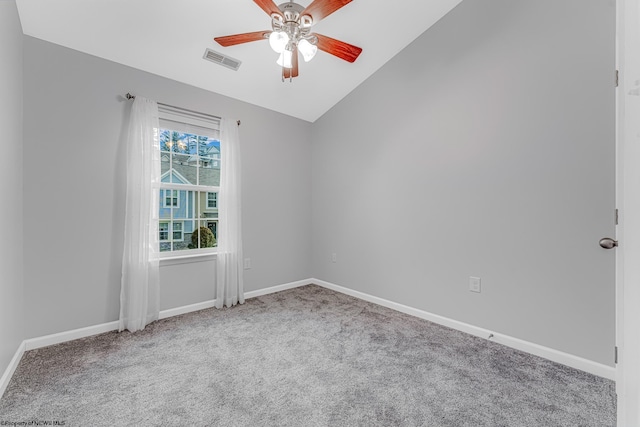 empty room with visible vents, a ceiling fan, baseboards, carpet, and lofted ceiling