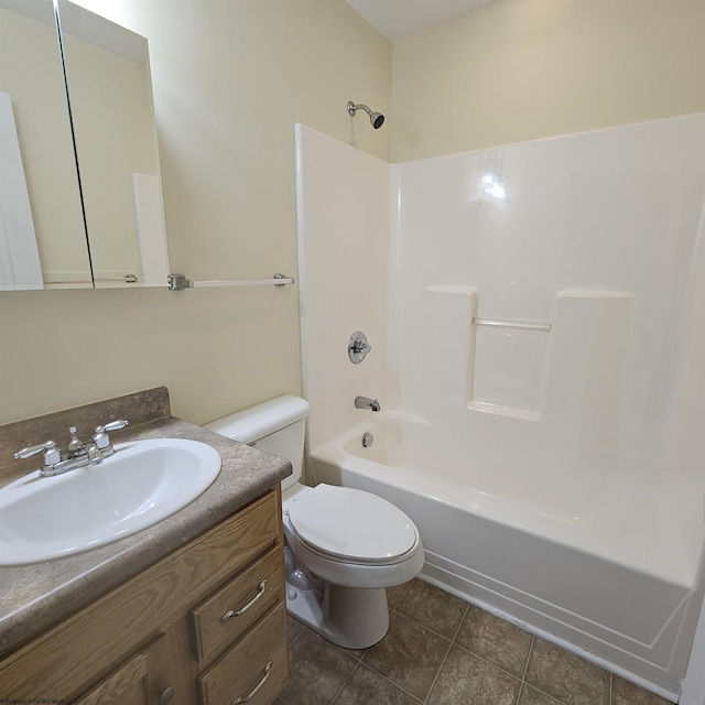 bathroom featuring vanity, tile patterned floors, toilet, and shower / tub combination