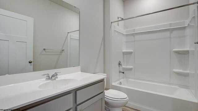 full bathroom with tub / shower combination, toilet, and vanity