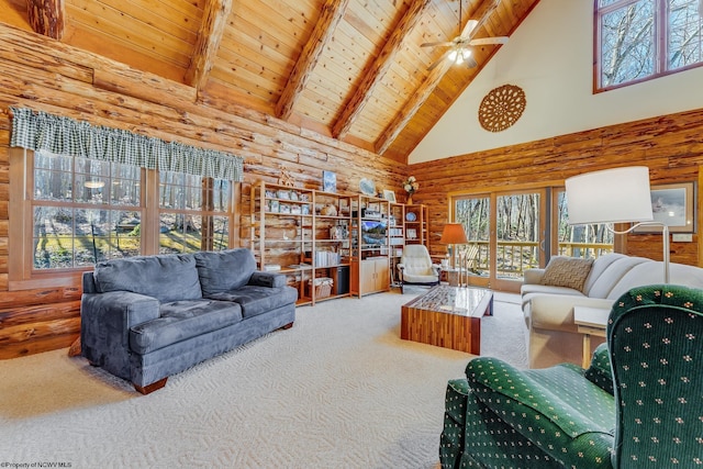 living room featuring plenty of natural light, wooden ceiling, and carpet