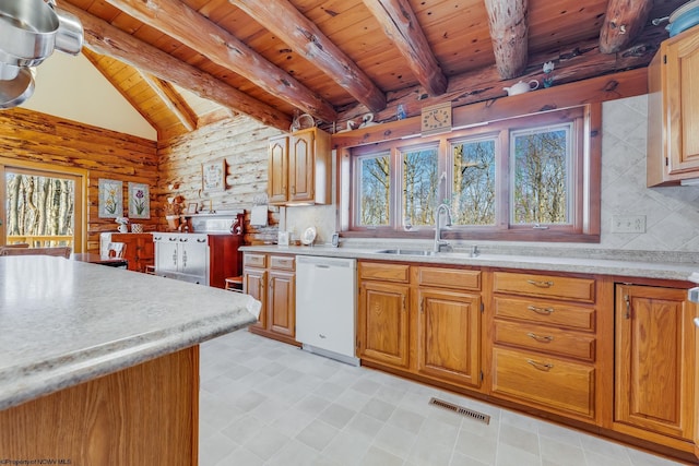 kitchen with a sink, visible vents, a wealth of natural light, and white dishwasher