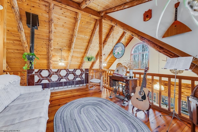 living area featuring wood ceiling, vaulted ceiling with beams, and hardwood / wood-style flooring