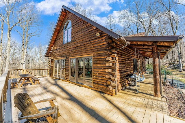 wooden terrace featuring grilling area