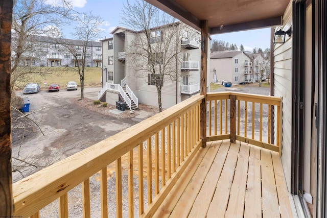 wooden terrace featuring a residential view