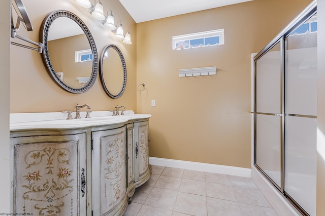 full bathroom with tile patterned floors, an enclosed shower, baseboards, and vanity