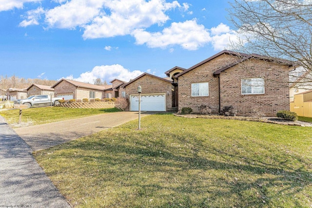 single story home featuring brick siding, driveway, an attached garage, and a front lawn