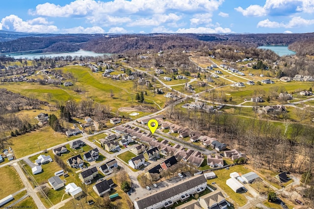 drone / aerial view with a water view and a residential view