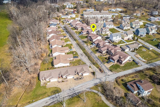 birds eye view of property with a residential view