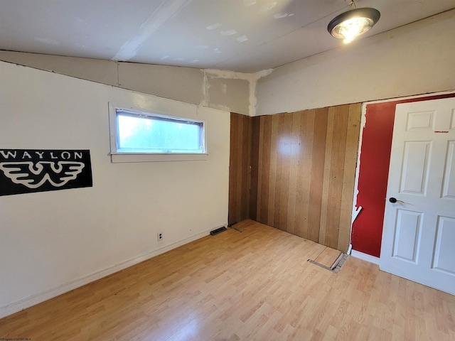 unfurnished room with light wood-type flooring