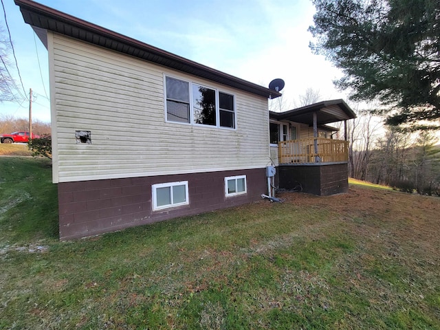 view of property exterior with a yard