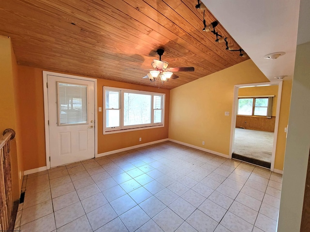 unfurnished room featuring baseboards, ceiling fan, wooden ceiling, rail lighting, and light tile patterned flooring