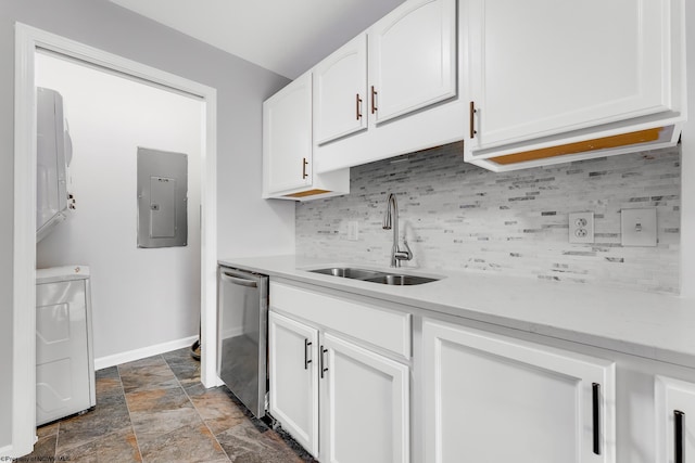 kitchen with electric panel, dishwasher, light countertops, and a sink