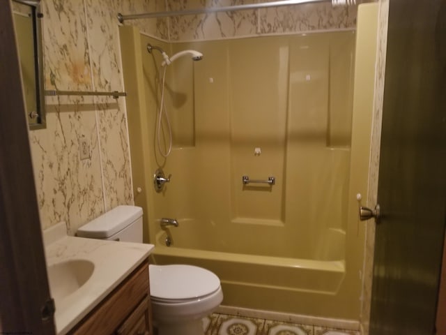 full bathroom featuring toilet, vanity, wallpapered walls, and shower / bathtub combination