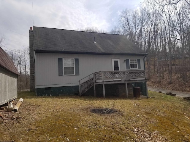 back of house featuring crawl space, a wooden deck, a shingled roof, and central AC