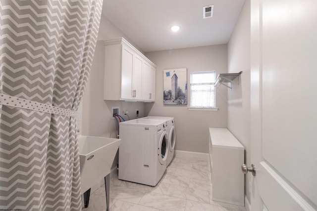laundry room featuring visible vents, cabinet space, separate washer and dryer, a sink, and marble finish floor