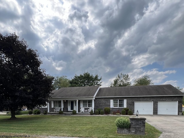 ranch-style home with a front yard, an attached garage, covered porch, and concrete driveway