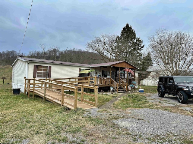 6615 Old Mill Rd, Jane Lew, WV 26378 - view of front of home with a deck and a front lawn