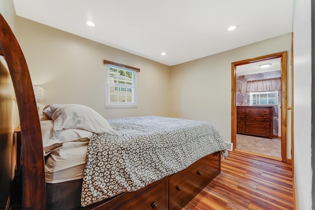 bedroom featuring recessed lighting, visible vents, baseboards, and wood finished floors