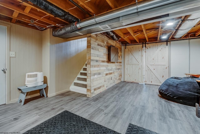 finished below grade area with wood finished floors and stairs