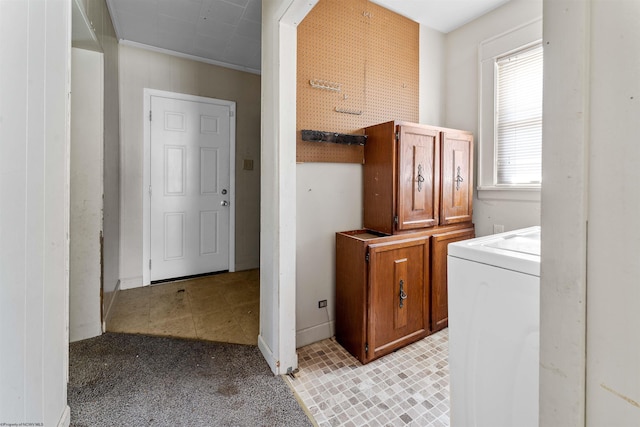 laundry room with washer / clothes dryer and light carpet