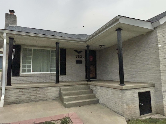 762 Pearl St, Grafton, WV 26354 - entrance to property with a chimney, a shingled roof, and a porch