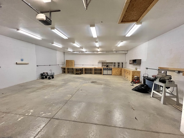 762 Pearl St, Grafton, WV 26354 - garage featuring concrete block wall and a garage door opener
