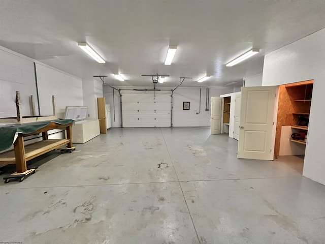 762 Pearl St, Grafton, WV 26354 - garage with a garage door opener and freestanding refrigerator