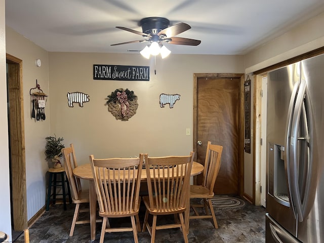 dining room with baseboards and ceiling fan