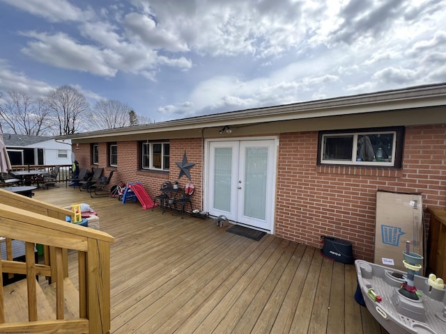 wooden deck featuring french doors