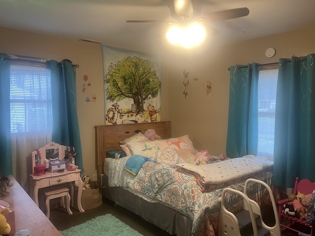 bedroom with visible vents and a ceiling fan