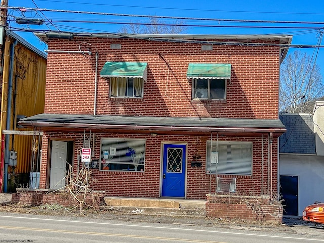 view of front of house featuring brick siding
