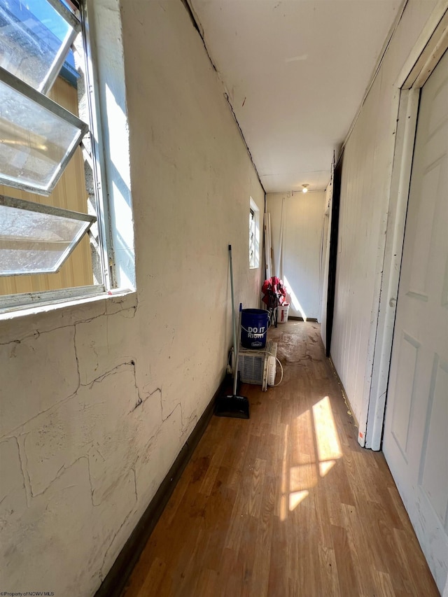 hallway with wood finished floors
