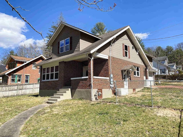 view of front of property featuring a front yard, fence, brick siding, and a garage