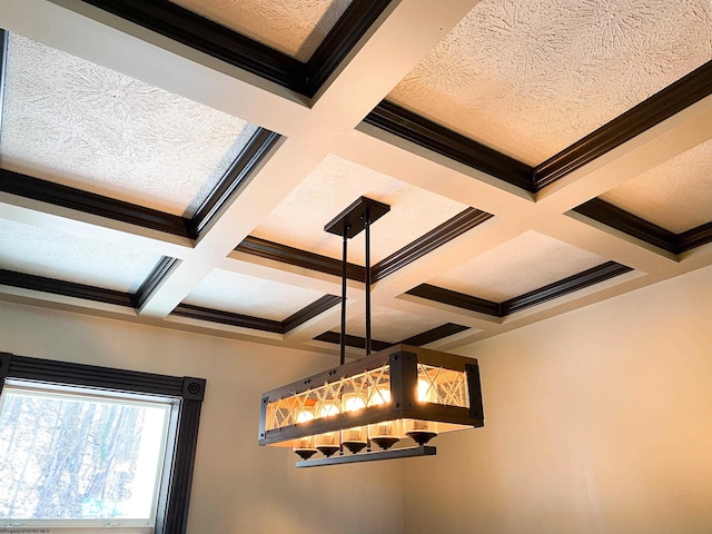 details featuring a textured ceiling, coffered ceiling, and beamed ceiling