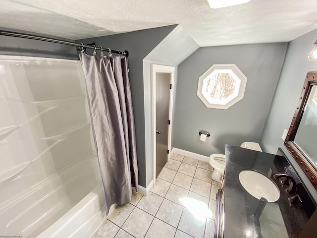 full bathroom with tile patterned floors, vanity, a textured ceiling, lofted ceiling, and baseboards