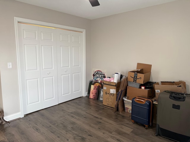 bedroom with a ceiling fan, a closet, and dark wood finished floors
