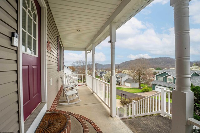 view of patio with a residential view and a porch