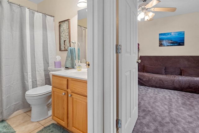 bathroom with tile patterned floors, toilet, ceiling fan, and vanity