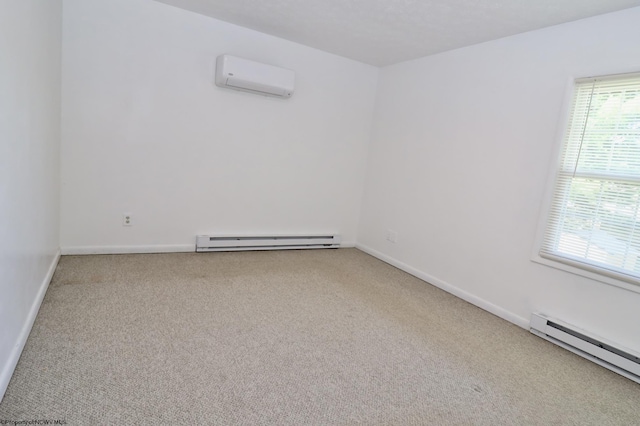 spare room with carpet flooring, an AC wall unit, baseboards, and baseboard heating