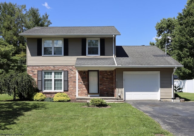 traditional home with driveway, brick siding, a front lawn, a shingled roof, and a garage