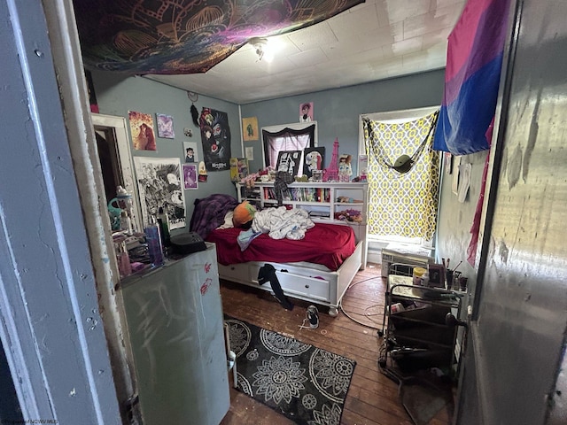 bedroom with hardwood / wood-style floors