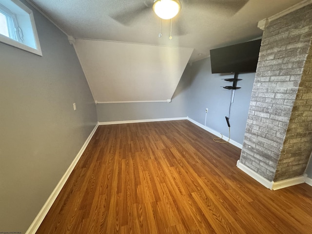 2458 Brushy Fork Rd, Buckhannon, WV 26201 - additional living space with baseboards, a ceiling fan, a textured ceiling, vaulted ceiling, and wood finished floors