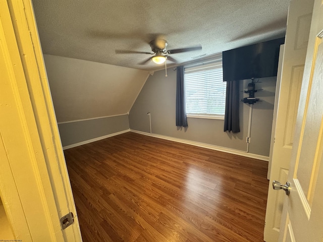 2458 Brushy Fork Rd, Buckhannon, WV 26201 - bonus room featuring baseboards, a ceiling fan, a textured ceiling, wood finished floors, and lofted ceiling