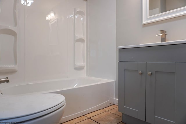 bathroom featuring bathing tub / shower combination, tile patterned floors, vanity, and toilet