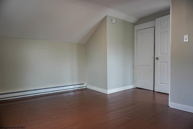 bonus room featuring dark wood finished floors, lofted ceiling, baseboards, and baseboard heating