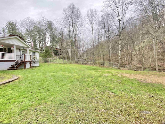 view of yard featuring stairway and a fenced backyard