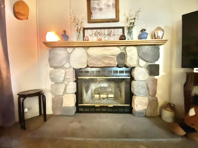 details with a stone fireplace