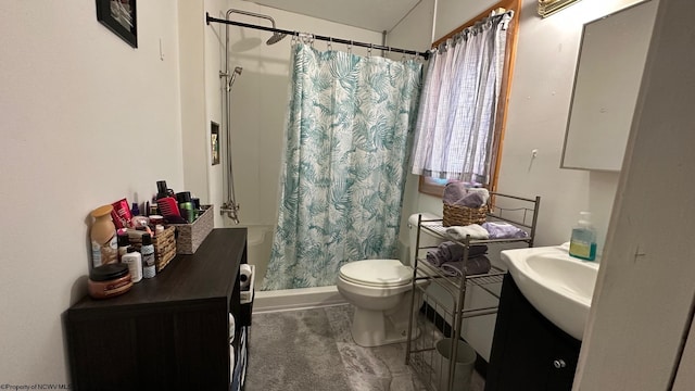 full bath featuring toilet, vanity, and curtained shower