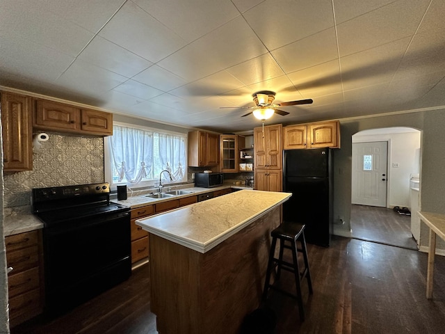 3429 Freedom Hwy, Fairmont, WV 26554 - kitchen featuring a wealth of natural light, a center island, a sink, and black appliances