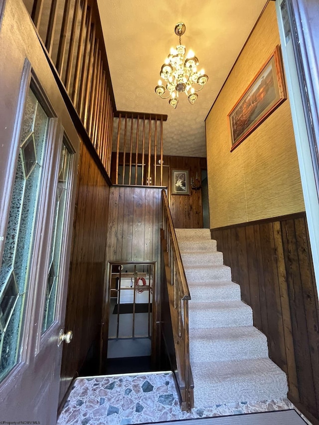 50 Lorraine Ln, Bowden, WV 26254 - staircase featuring a chandelier and wooden walls